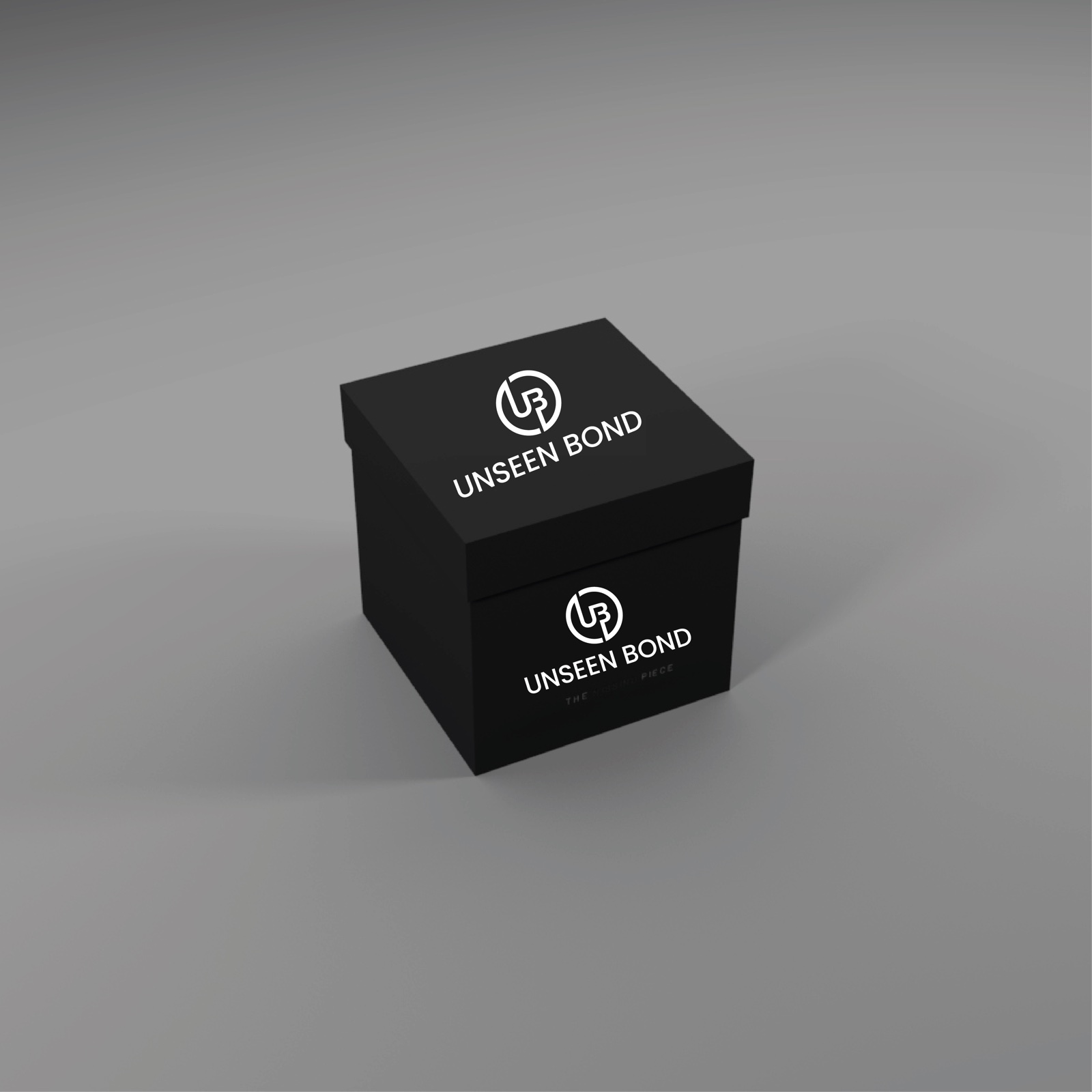 Matt black Unseen Bond gift box with the UB monogram and the line The Missing Piece